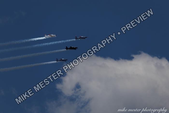 Protected preview of Four Aircraft Above a White Cloud, an original Mike Mester photograph