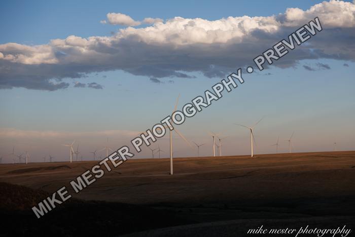 Protected preview of Wind Turbines Beneath Gathering Clouds, an original Mike Mester photograph